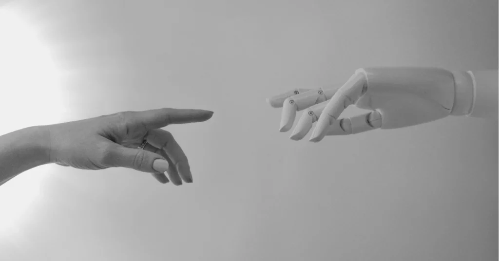 Robot and Human Hand to Represent AI